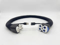 A water and data extension hose compatible with the Eight Sleep Pod. Plastic fittings at both ends for water flow, as well as a USB extension cable. The tubing of the unit is wrapped in a soft black fabric.