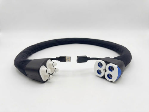 A water and data extension hose compatible with the Eight Sleep Pod. Plastic fittings at both ends for water flow, as well as a USB extension cable. The tubing of the unit is wrapped in a soft black fabric.